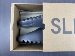 Adidas Yeezy Slide 'Onyx' -Fusion Wear Shop HYB212 1da886b2 0ee8 4b1e 9662 3398dc87b330