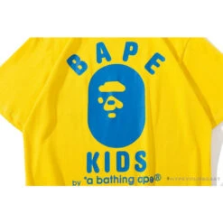 BAPE KIDS Small Net Pocket Ape Man Head Tee Shirt 'YELLOW' -Fusion Wear Shop fe3b7ea3
